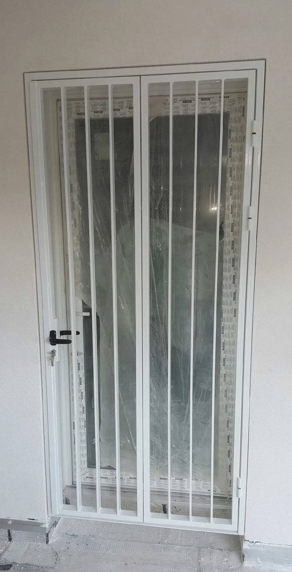 Réalisation grille de défense porte